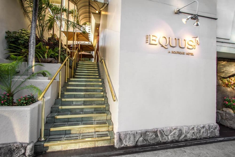 Entrance of The Equus, Waikīkī's family-operated boutique hotel with a 24-hour front desk